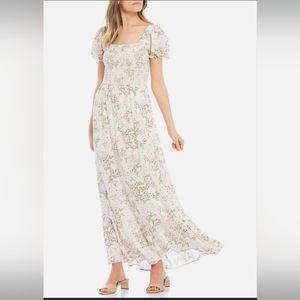 City vibe ivory and floral maxi dress. Size medium.
